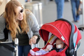 Amy Adams, sunglasses, gray sweater, gray coat, jeans, ring, bracelets, black purse